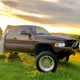 This is how you take photos to advertise a truck - in a green field close to heaven.